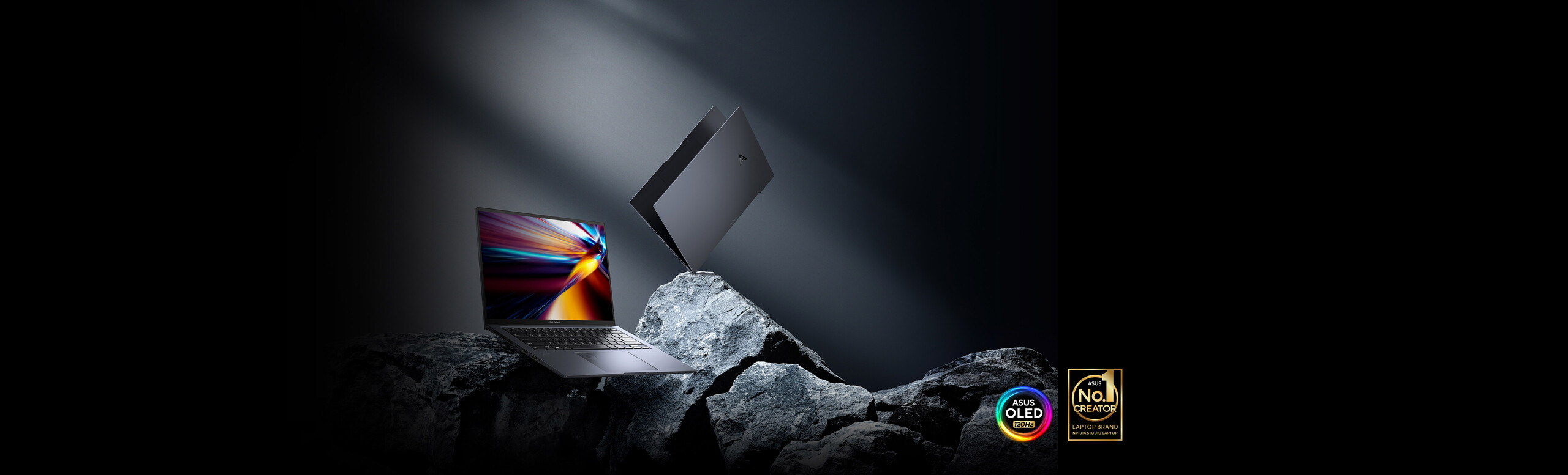 ASUS Zenbook Pro 14 OLED on the left is wide open on a rock, and right one is seen from rear. The No1 Creator and ASUS 120Hz OLED logo are placed over the two models.