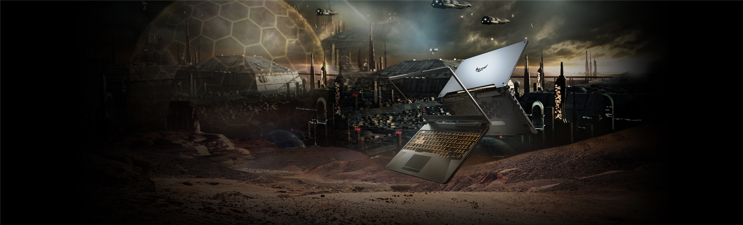 ASUS-TUF-Gaming-F15 laptopovi prikazani kako lebde ispred futuristicnog postrojenja u pustinji sa zutom svetlecom tastaturom