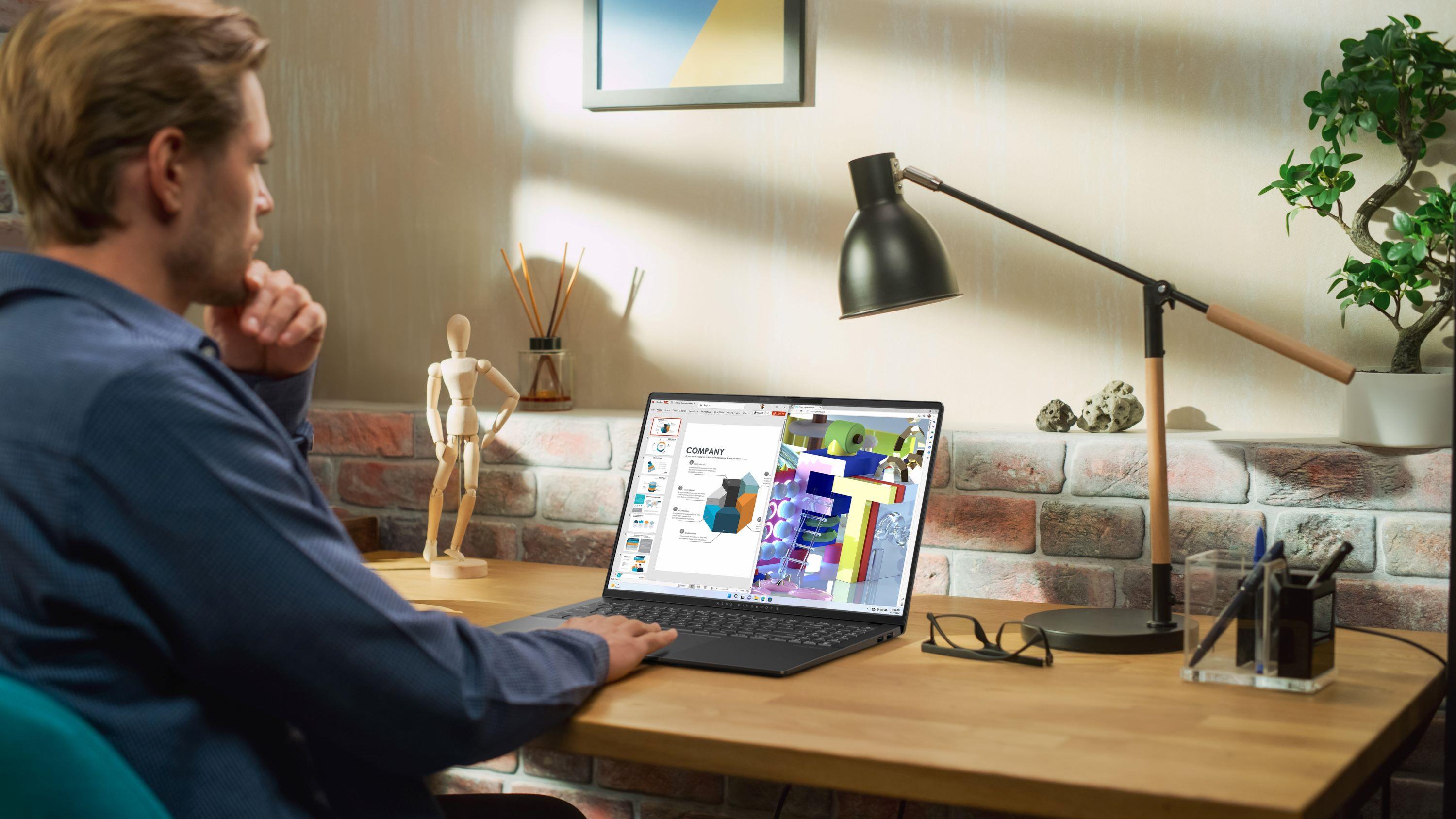 A man using an ASUS Vivobook for graphic design