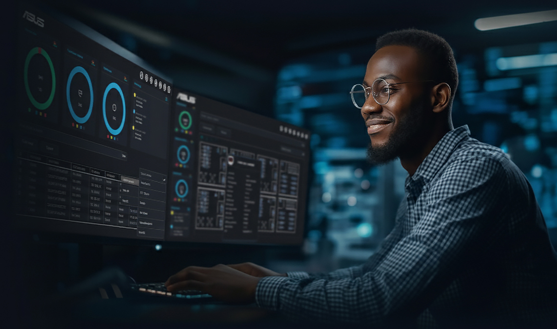A person functioning as IT staff sits at a desk in a dark room, working on a computer with dual monitors displaying the ASUS Control Center Express software interface. The screens show system performance data, charts, and control panels.